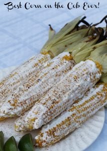 elotes - corn on the cob with sour cream, chili powder, cotija, and lime