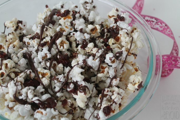 Easy Popcorn Recipes: Chocolate Cherry Popcorn uses just 3 ingredients and is a quick and easy treat to make for Valentine's Day or any day. Best of all it's nut-free and gluten-free. | www.realthekitchenandbeyond.com