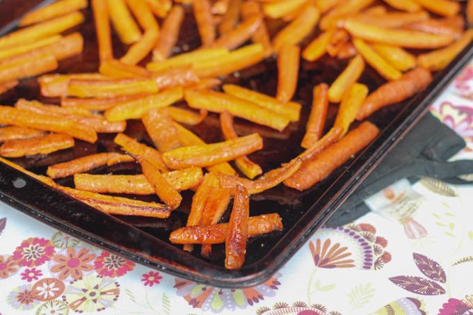 Honey Roasted Carrots make an easy veggie side dish for busy evenings. Roasting them with honey brings a subtle caramel flavor to the dish.
