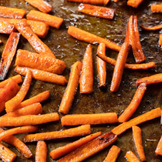 roasted carrot sticks on baking tray