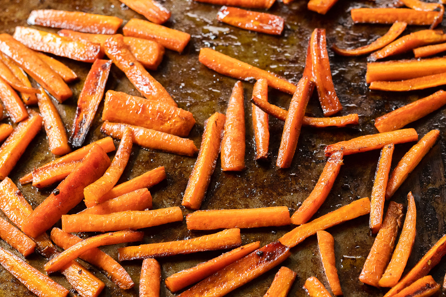 roasted carrot sticks on baking tray